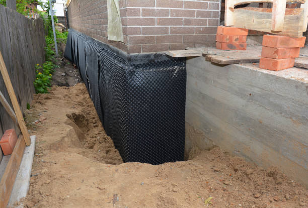 Happy homeowners after waterproofing job in Wisconsin Rapids